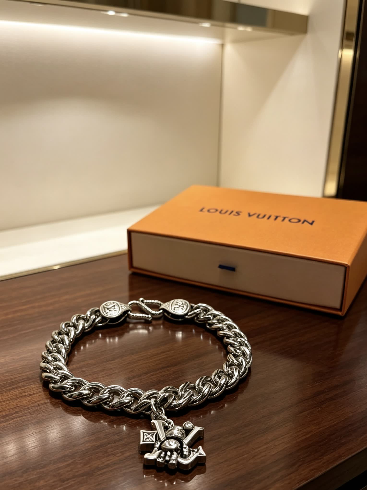 Louis Vuitton Silver Tone Bracelet with Monogram Charm